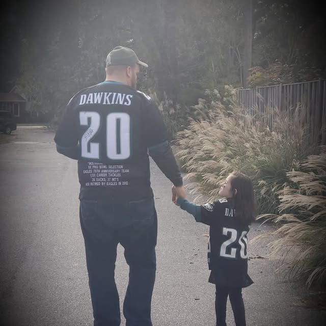 Dad and Jayleena in Eagles jerseys