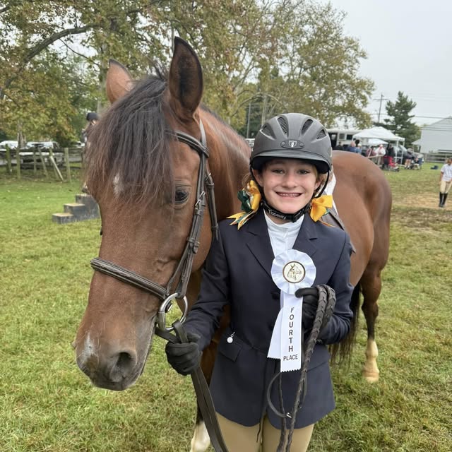 Jayleena with horse and ribbon