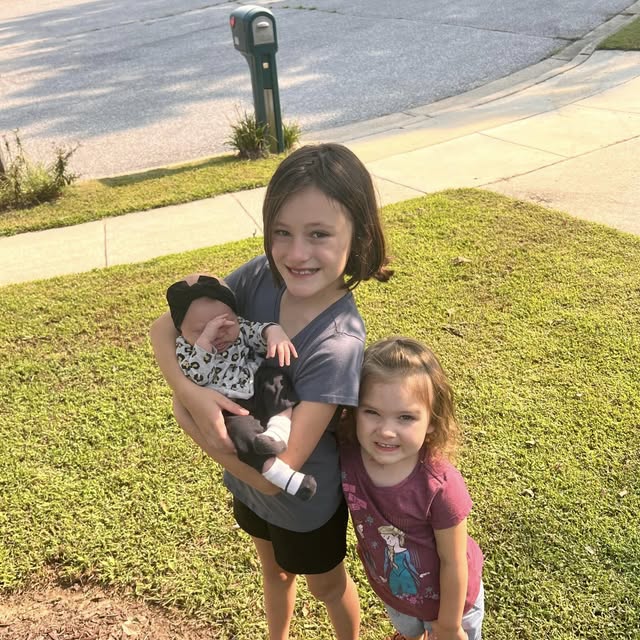 Sisters with newborn